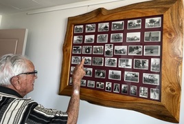 Frank looking through his photos from the early days of Caboolture_.jpg Frank looking through his photos from the early days of Caboolture_.jpg