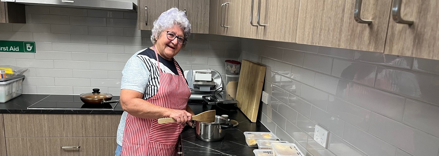 Margaret cooking up meals during the Townsville floods.jpg