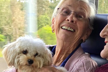 Romeo accompanying residents on a bus trip.jpg